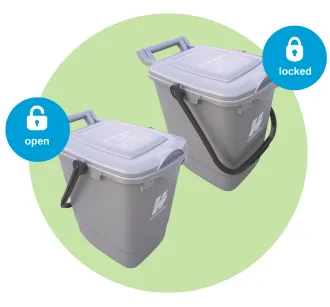 Food waste bins showing the handle forward is locked and the handle back is open.