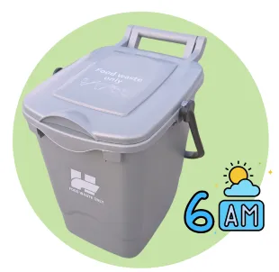 A silver food waste bin with 6am clock.