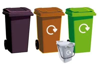 Black, brown, green bin and new silver food waste bin in a row.