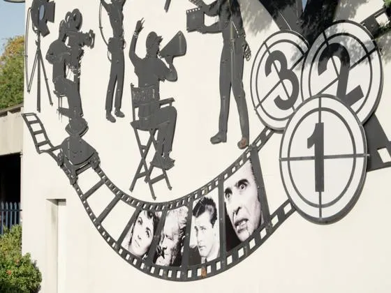 A film reel image on a wall.