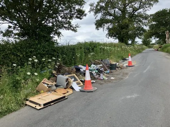 a Fly-tipping incident on the side of a road