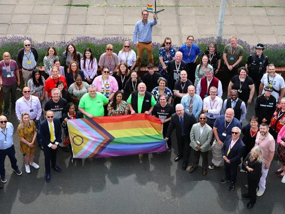 Group shot with Pride flag