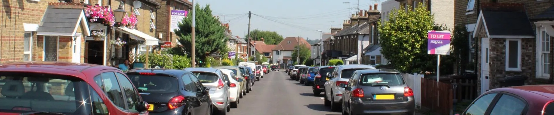 image of cars parked in residential street